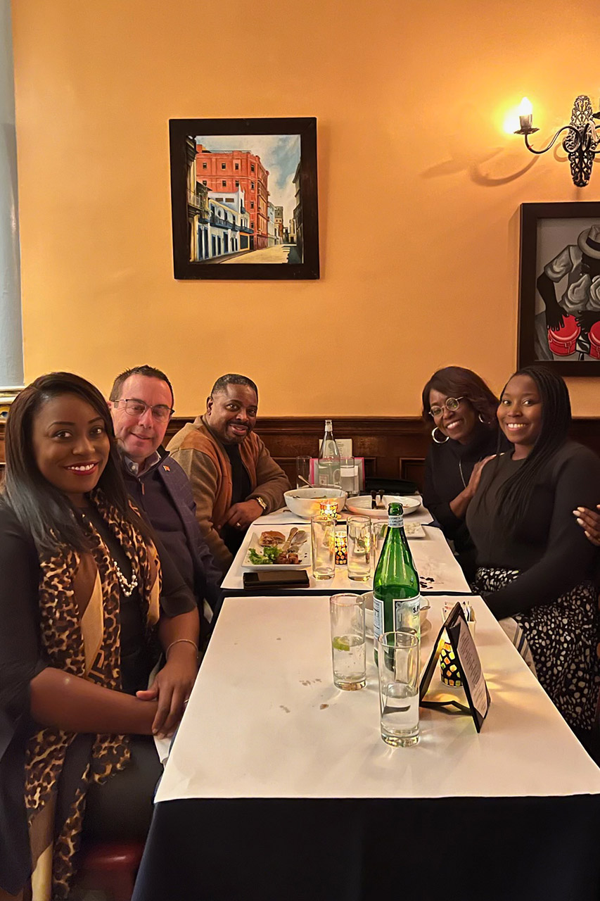 Dr. David Ireland enjoys a bite to eat with his wife, Dr. Marlinda Ireland, along with their two daughters and son-in-law.